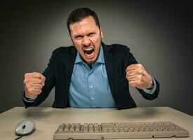 Portrait angry upset young man in blue shirt and jacket photo