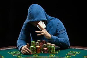 Poker player showing a pair of aces photo
