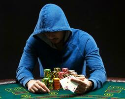 Poker player showing a pair of aces photo