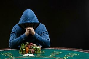 Poker player looking at combination of two aces. Closeup photo