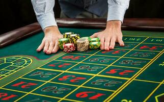 Picture of a green table and betting with chips. photo