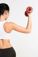 Sports young woman with dumbbells. human half photo