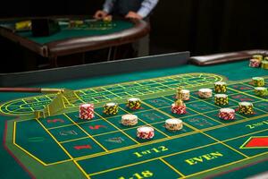 Picture of a green table and betting with chips. photo