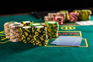 Poker chips on a poker table at the casino photo