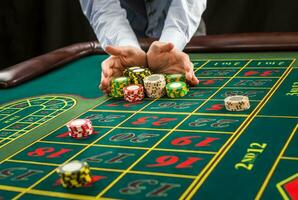 Picture of a green table and betting with chips. photo