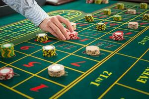 Picture of a green table and betting with chips. photo