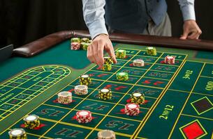 Picture of a green table and betting with chips. photo