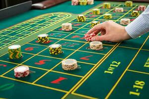 Picture of a green table and betting with chips. photo