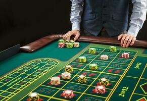 Picture of a green table and betting with chips. photo