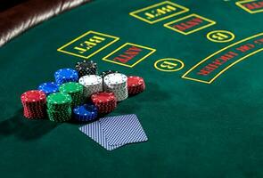 Poker play. Chips and cards photo