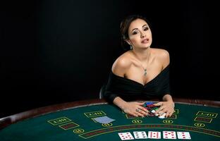 sexy woman with poker cards and chips photo