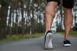 young athlete running in the forest photo