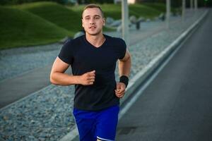 Close-up portrait of athletic man running photo