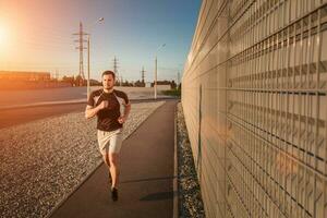 Full length portrait of athletic man running photo