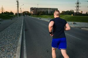 Close-up portrait of athletic man running photo