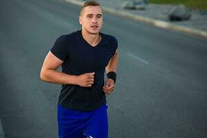 Close-up portrait of athletic man running photo