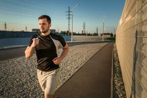 Close-up portrait of athletic man running photo