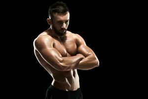 Muscular bodybuilder guy doing posing photo