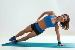 Sporty flexible girl doing stretching exercise photo