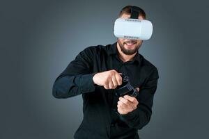 young man using a VR headset glasses photo