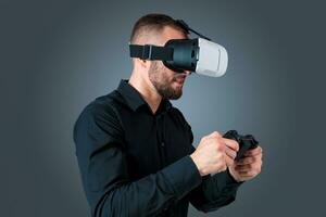 young man using a VR headset glasses photo