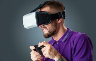 young man using a VR headset glasses photo