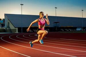 Runner sprinting towards success on run path running athletic track. Goal achievement concept. photo