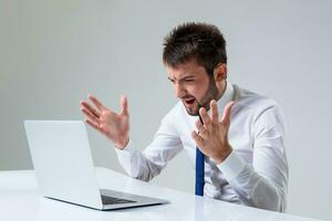 emotional man and laptop photo