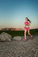 Running woman. Runner jogging in sunny nature. photo