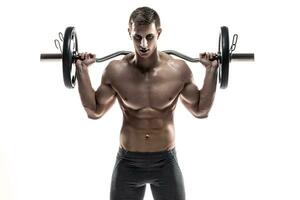 Strong man exercising fitness body building exercises with a barbell photo