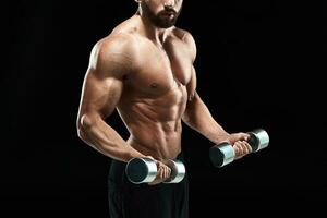 Muscular bodybuilder guy doing posing photo