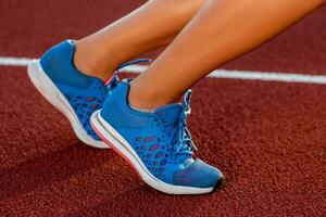 Close-up of woman's legs on start before jogging photo