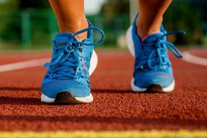 Close-up of woman's legs on start before jogging photo