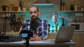 Influencer holding coffee cup and recording podcast in home studio. Creative online show Onair production internet broadcast host streaming live content, recording digital social media communication photo