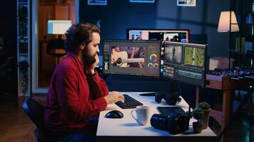 Video production specialist merging raw clips and footage into finished news segment content. Videographer operating computer editing systems and equipment in production studio, dolly out shot photo