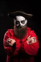 Scary bearded pirate with hands crossed over black background. Halloween disguiese photo