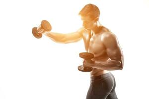 Athletic man showing muscular body and doing exercises with dumbbells photo
