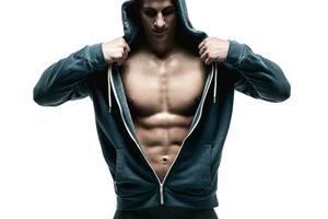 Handsome man with open jacket revealing muscular chest and abs photo