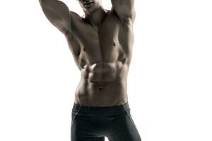 Strong man showing perfect body, abs and chest. Close-up photo