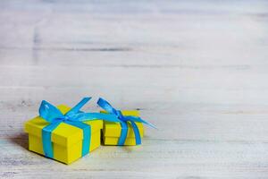 Gift boxes on wooden table. Collection of gift boxes on wooden board holidays concept. Presents for any holiday concept photo