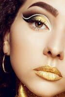 Magic Girl Portrait in Gold. Golden Makeup photo