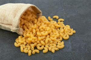 Elbow macaroni in bowl photo