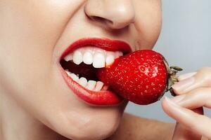 Sexy Woman wearing Eating Strawberry. photo