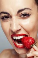 Sexy Woman wearing Eating Strawberry. photo