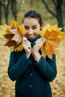 autumn walk girl in the coat in woods photo