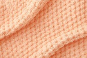 AI generated soft knitted sweater fabric in color of the year 2024 peach fuzz photo