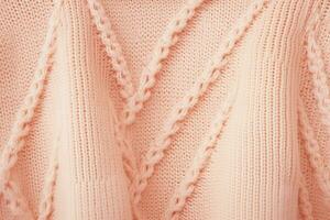 AI generated soft knitted sweater fabric in color of the year 2024 peach fuzz photo