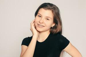 Portrait of teen girl showing dental braces. photo