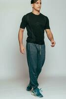 Studio shot of a handsome young fitness man photo