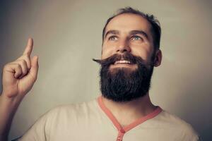 emotional  young bearded man  good idea sign Hipster style photo